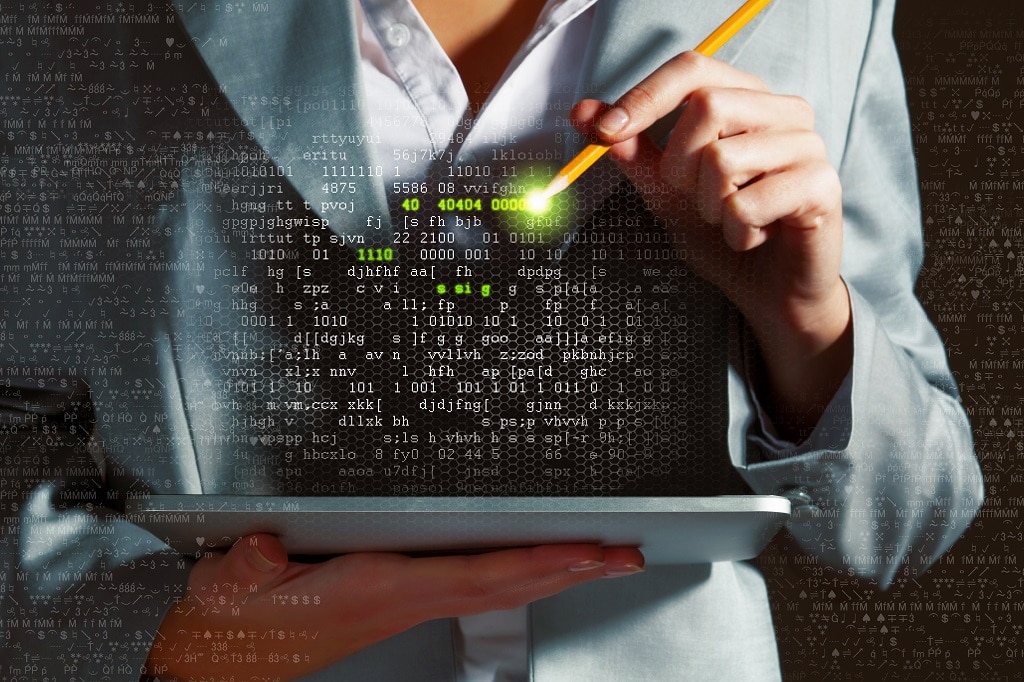 Businesswoman holding tablet pc entering password. Security concept